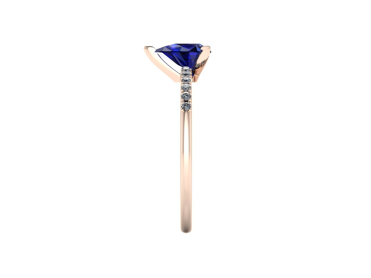 Side profile product photo of the Calista ring, displaying the elegant, secure three-prong basket setting holding the pear-cut blue sapphire.