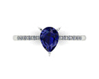 Detail shot of the Calista alternative bridal ring, showing the rich depth of colour and facet reflections within the central blue sapphire.