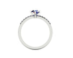 Through-finger view of the 18ct white gold or platinum sapphire ring, showing the smooth interior under-gallery and precise stone settings.