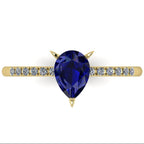 Detail shot of the Calista bridal ring, showing the rich depth of colour and exceptional facet light reflections within the central blue sapphire.