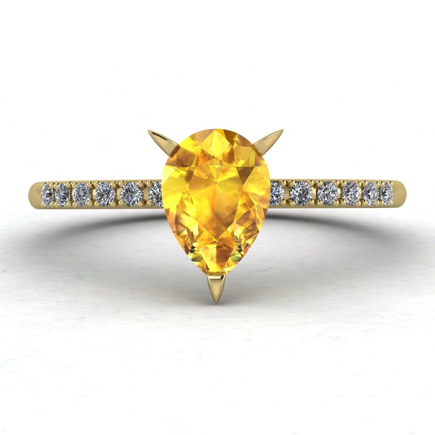Calista engagement ring in 18ct yellow gold, capturing the vibrant sun-drenched sparkle of the pear-shaped yellow sapphire and surrounding diamonds.