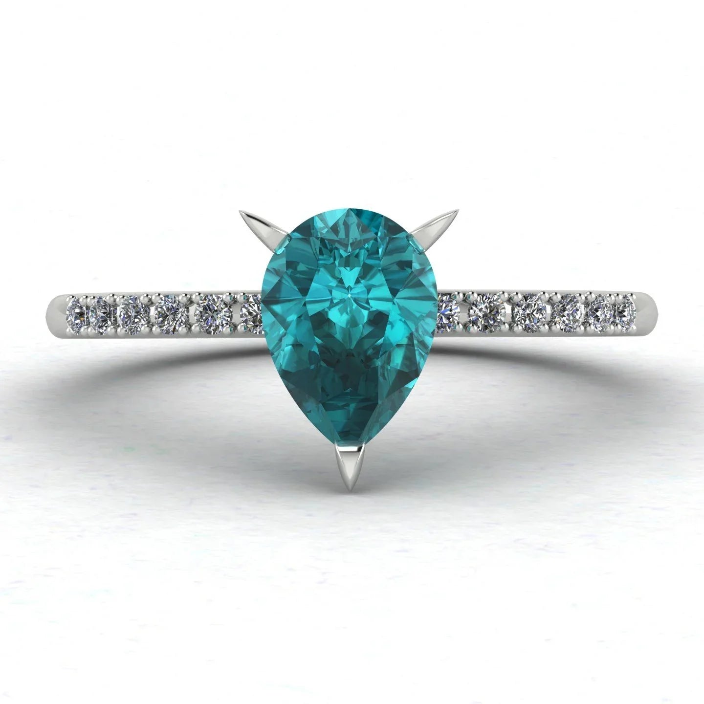 Front view hero shot of the Calista 18ct white gold ring, featuring a rich pear-shaped teal sapphire surrounded by a halo of white diamonds