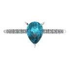 Calista pear shaped teal sapphire and diamond engagement ring in 18ct white gold, top-down view showing the pear-cut teal sapphire and diamond shoulders, handmade in our London studio
