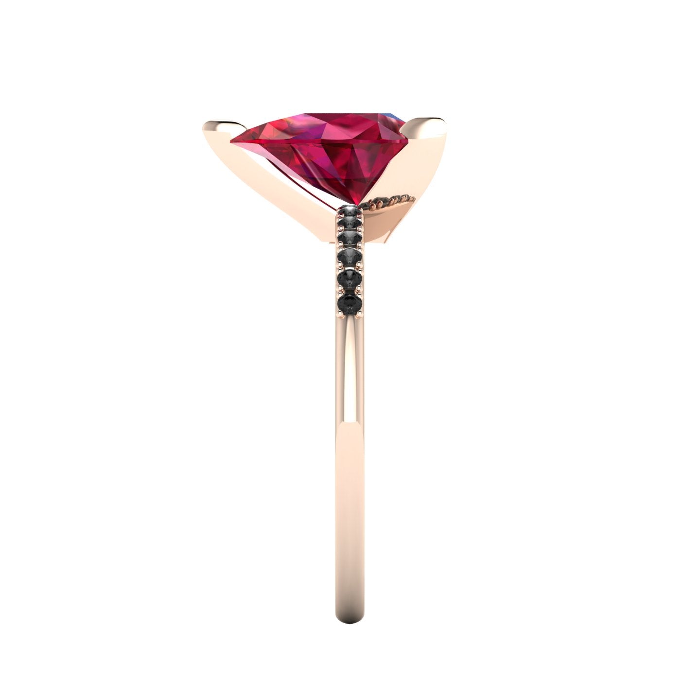 Side profile product photo of the Calista ring, highlighting the elegant three-prong basket setting holding the pear-cut ruby.