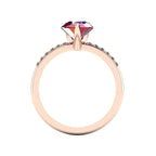 Through-finger view of the 18ct rose gold ruby ring, displaying the clean interior under-gallery and precise gemstone settings.