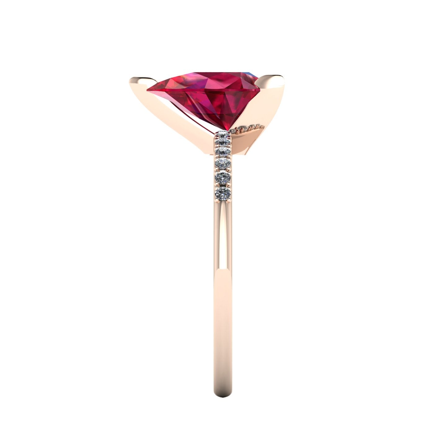 Side profile product photo of the Calista ring, displaying the elegant three-prong basket setting holding the pear-cut ruby.