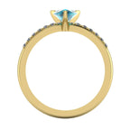 Through-finger view of the 18ct gold Calista pear teal sapphire ring, showing the clean interior under-gallery and setting structure.