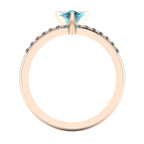 Through-finger view of the 18ct rose gold Calista pear teal sapphire ring, showing the clean interior under-gallery and setting structure.