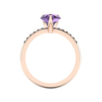 Through-finger view of the 18ct rose gold violet sapphire ring, showing the clean interior under-gallery and precise stone settings.