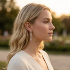 Side profile showing a model wearing the handmade sterling silver Chain Reaction medium earrings to display their scale.