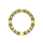 Through finger view of the eternity ring illustrating the rhythmic pattern of alternating emeralds and sapphires in a citrus-inspired palette.