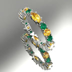 18ct white gold eternity ring featuring alternating marquise yellow sapphires and green emeralds in a claw setting.