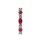 Macro detail of the Allsorts ring showcasing the rich red rubies and white diamonds set in polished rose gold.
