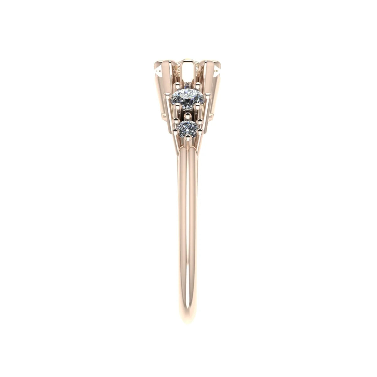 View along the shoulder of the Comet rose gold ring, showing two graduated round white diamonds leading towards the raised pear-shaped champagne diamond setting.