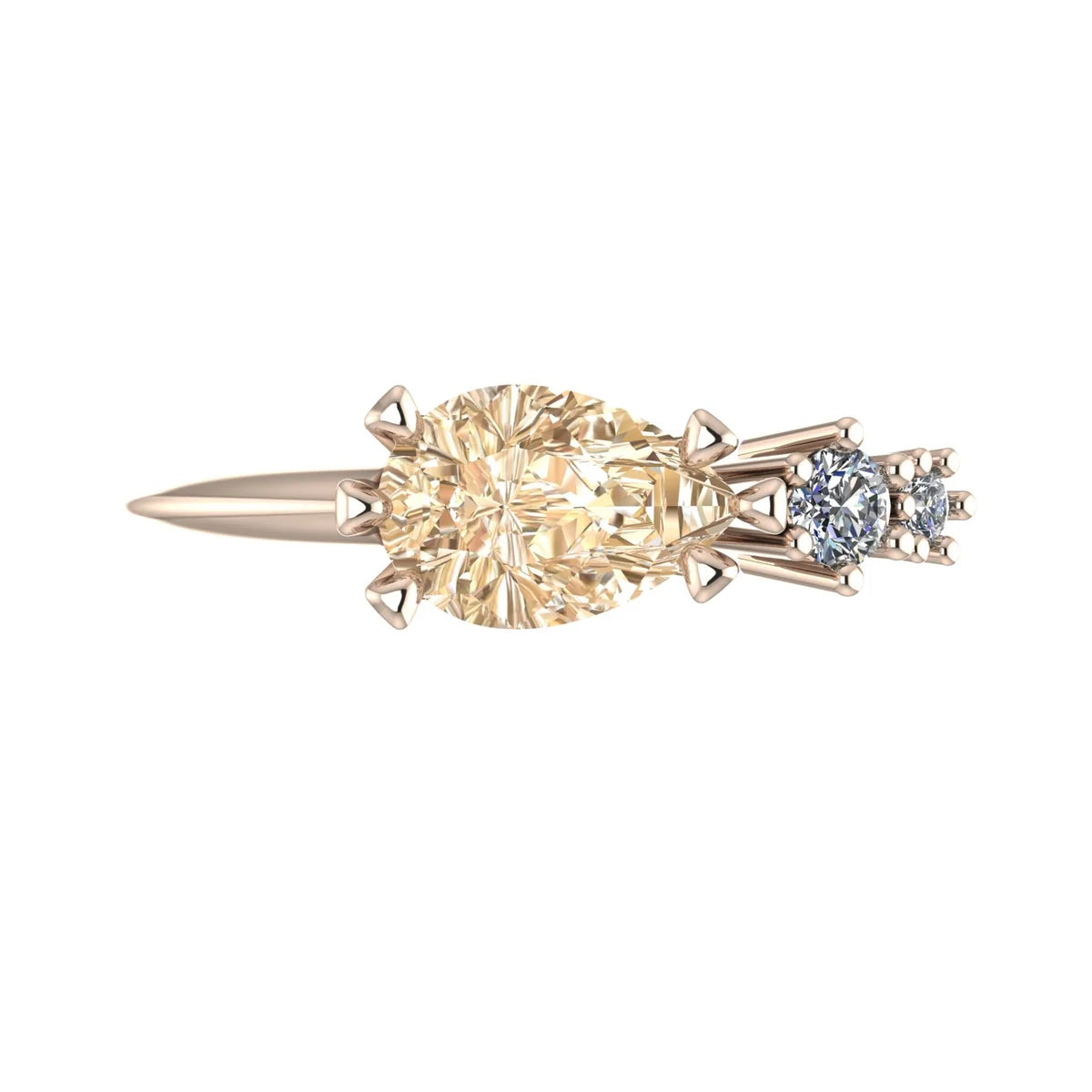 Top view of the Comet rose gold trilogy ring, showing a pear-shaped champagne diamond followed by two graduated round white diamonds in an asymmetric arrangement.