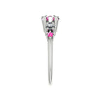 Side profile of the Comet pink sapphire and diamond asymmetrical ring in 18ct white gold, showing the sculptural claw setting and tapered split band
