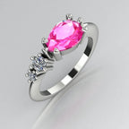 Comet asymmetrical engagement ring in 18ct white gold with a horizontally set pear shaped pink sapphire and two graduating diamonds, handmade in our London studio
