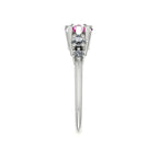 Side profile of the Comet pink sapphire and diamond trilogy ring in 18ct white gold, showing the sculptural claw setting and tapered split band
