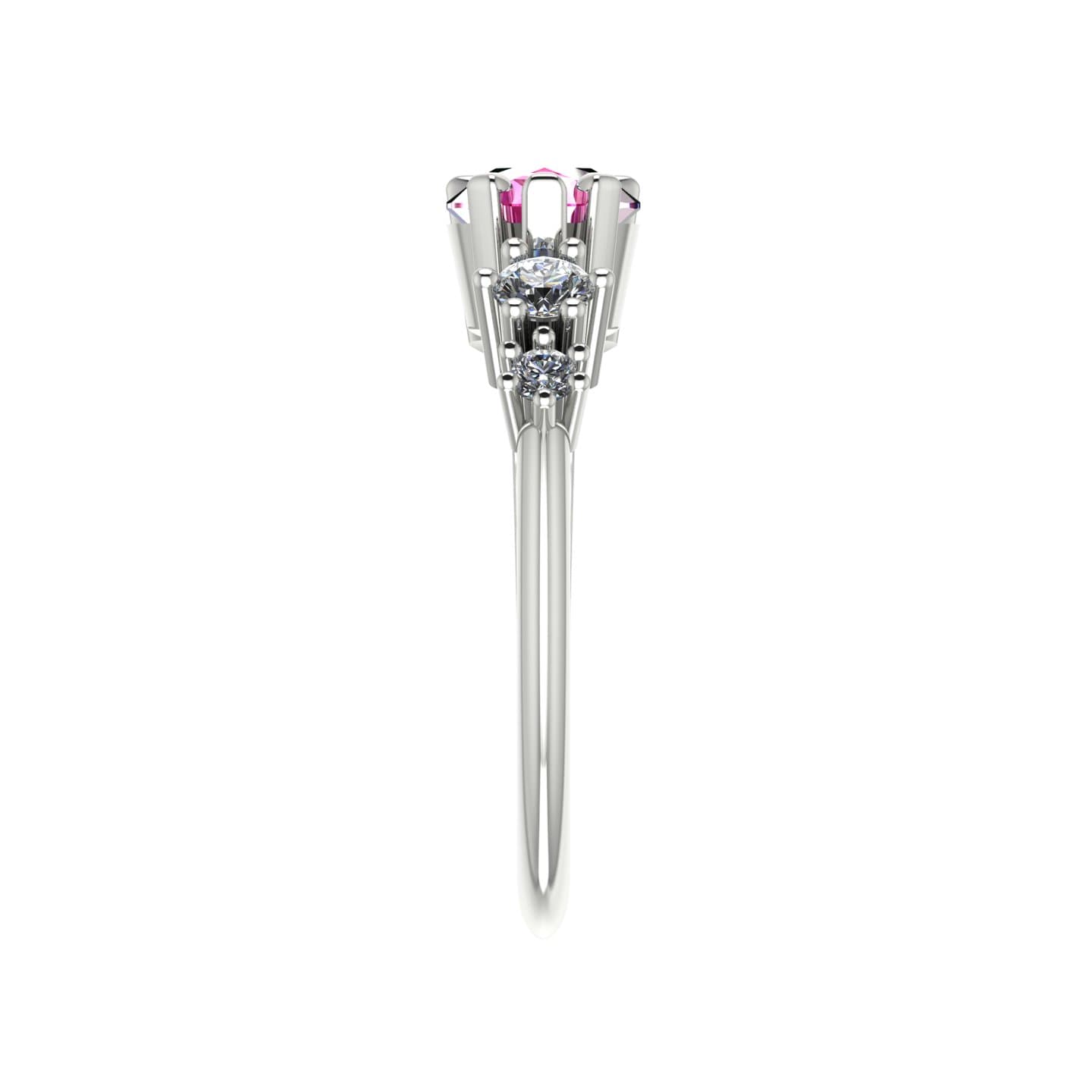 Side profile of the Comet pink sapphire and diamond trilogy ring in 18ct white gold, showing the sculptural claw setting and tapered split band