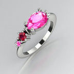 Asymmetrical Comet engagement ring in 18ct white gold with a pear shaped pink sapphire, round ruby and round pink sapphire, handmade in our London studio