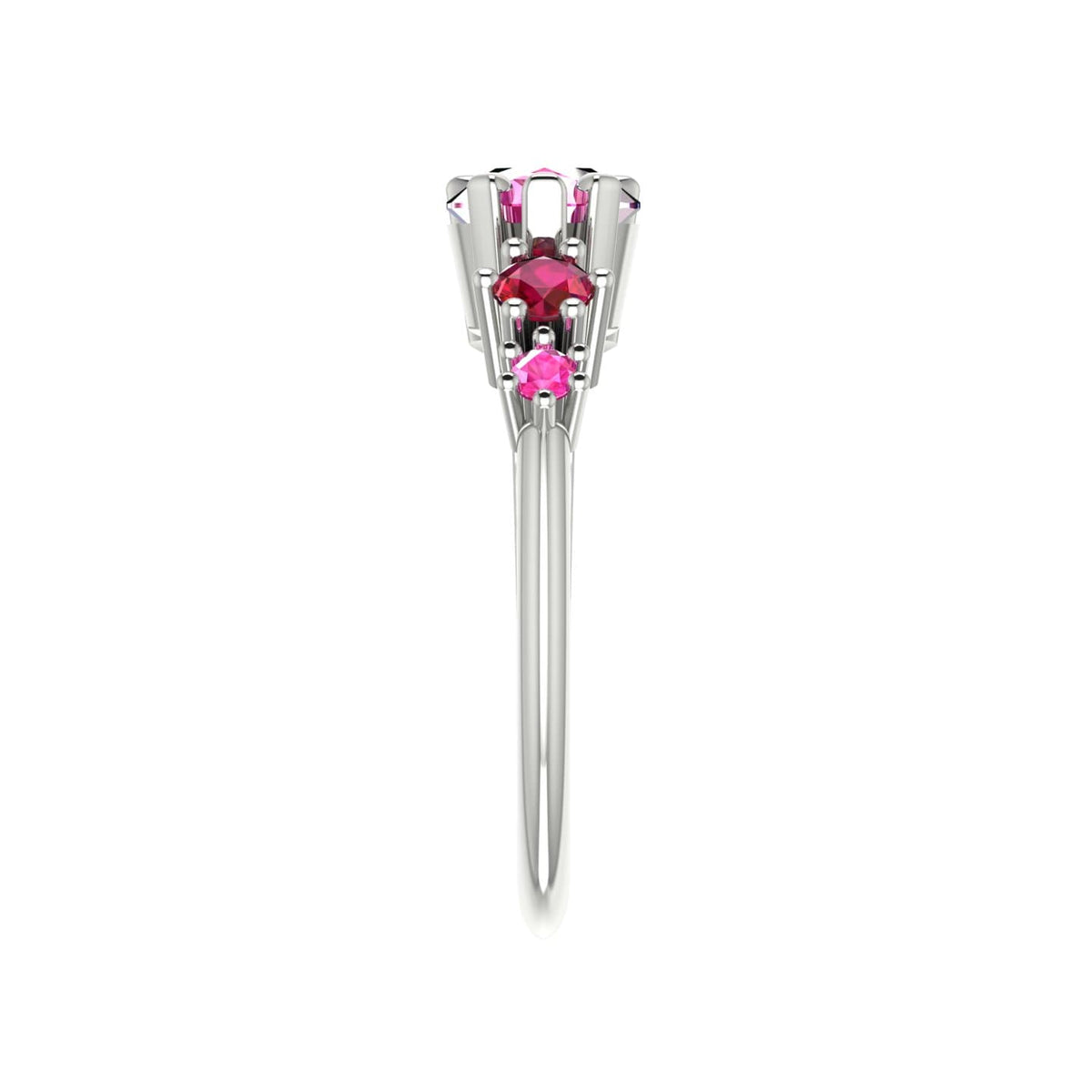 Side profile of the Comet pink sapphire and ruby asymmetrical ring in 18ct white gold, showing the sculptural claw setting and tapered band