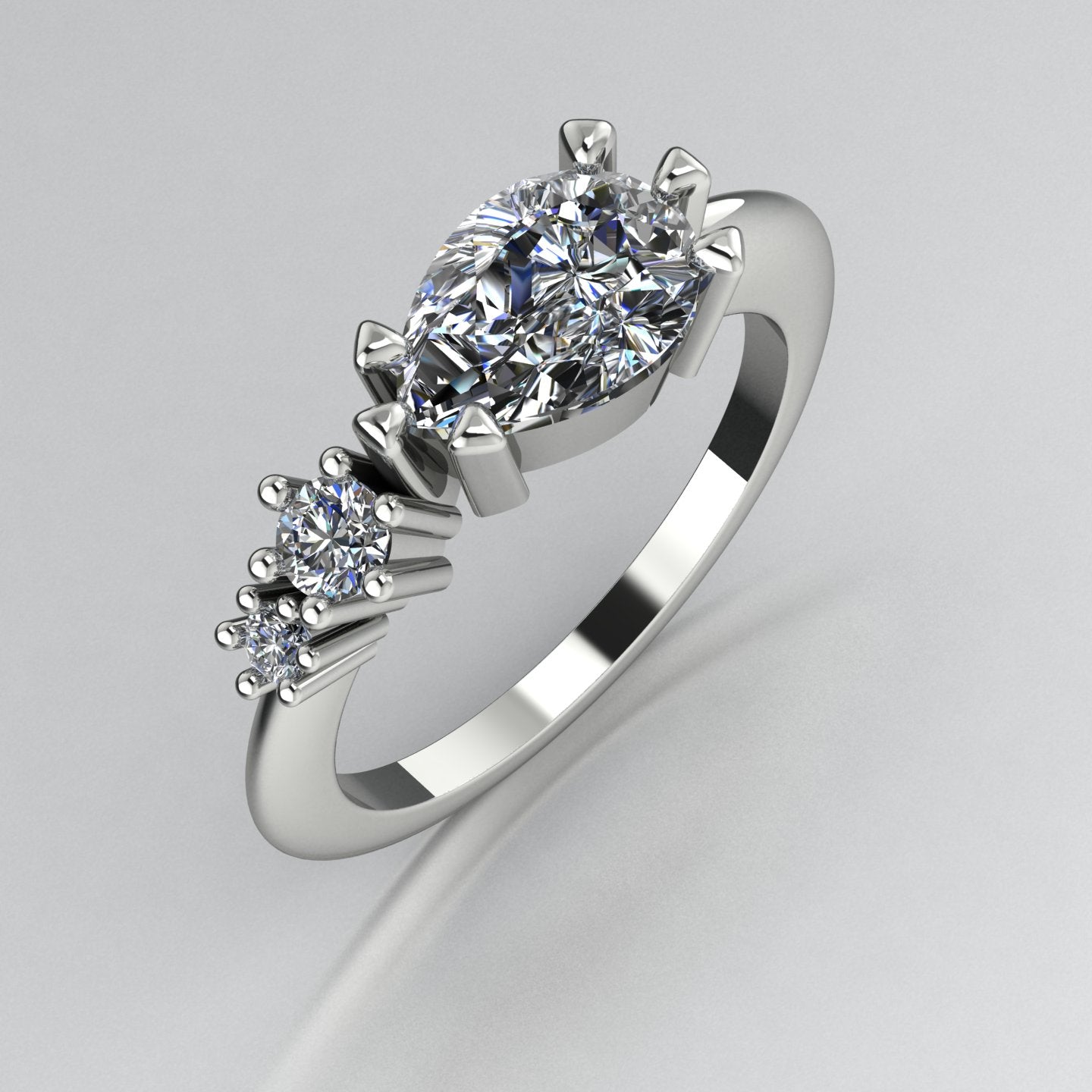 Comet Ring: Pear Shaped Lab Grown Diamonds Horizontally Set Trilogy Ring