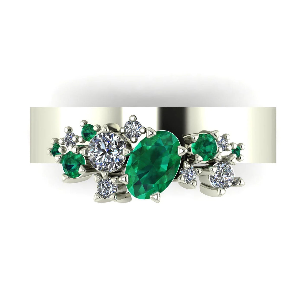 Front view of the Crystallised ring in white gold or platinum, featuring an oval emerald beside a round diamond, surrounded by smaller emeralds and diamonds.