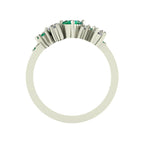 Front view of the Crystallised wide band ring with oval tsavorite centre stone and asymmetric diamond and tsavorite cluster, 18ct white gold