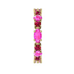 Macro detail of the Fire ring showcasing the vibrant red rubies and pink sapphires in a polished yellow gold setting.