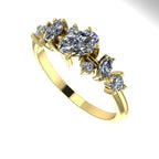 An angled view of the 18ct yellow gold Atlantis Paradise ring highlighting the light-reflecting facets of the diamond cluster.