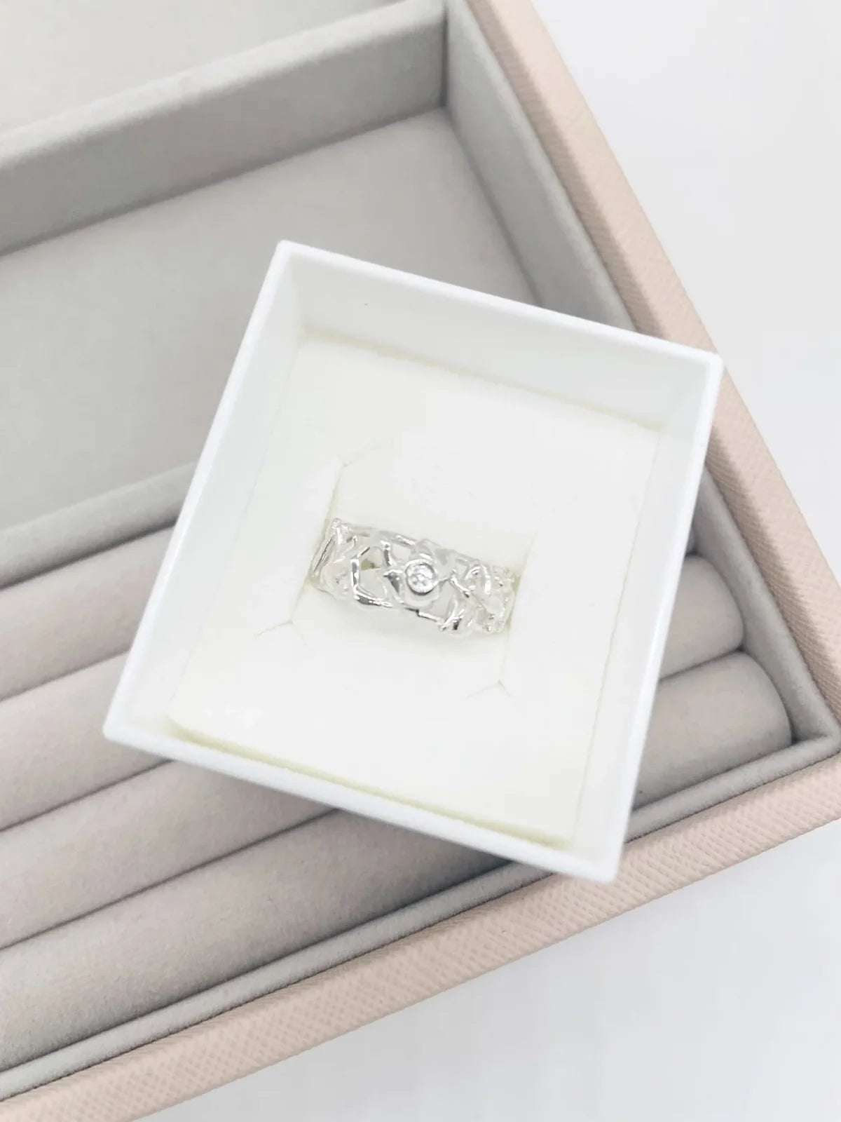 Origin Honeycomb Ring with a brilliant-cut diamond in sterling silver, presented in a Nude Jewellery box