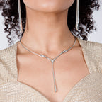 Drip Drop Silver Statement Necklace worn on model in gold top with matching silver drip earrings — sterling silver torque collar with drop pendant