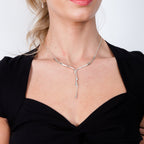 Dripping Silver Necklace worn on model in black dress with silver arm cuff — sterling silver lariat drip necklace