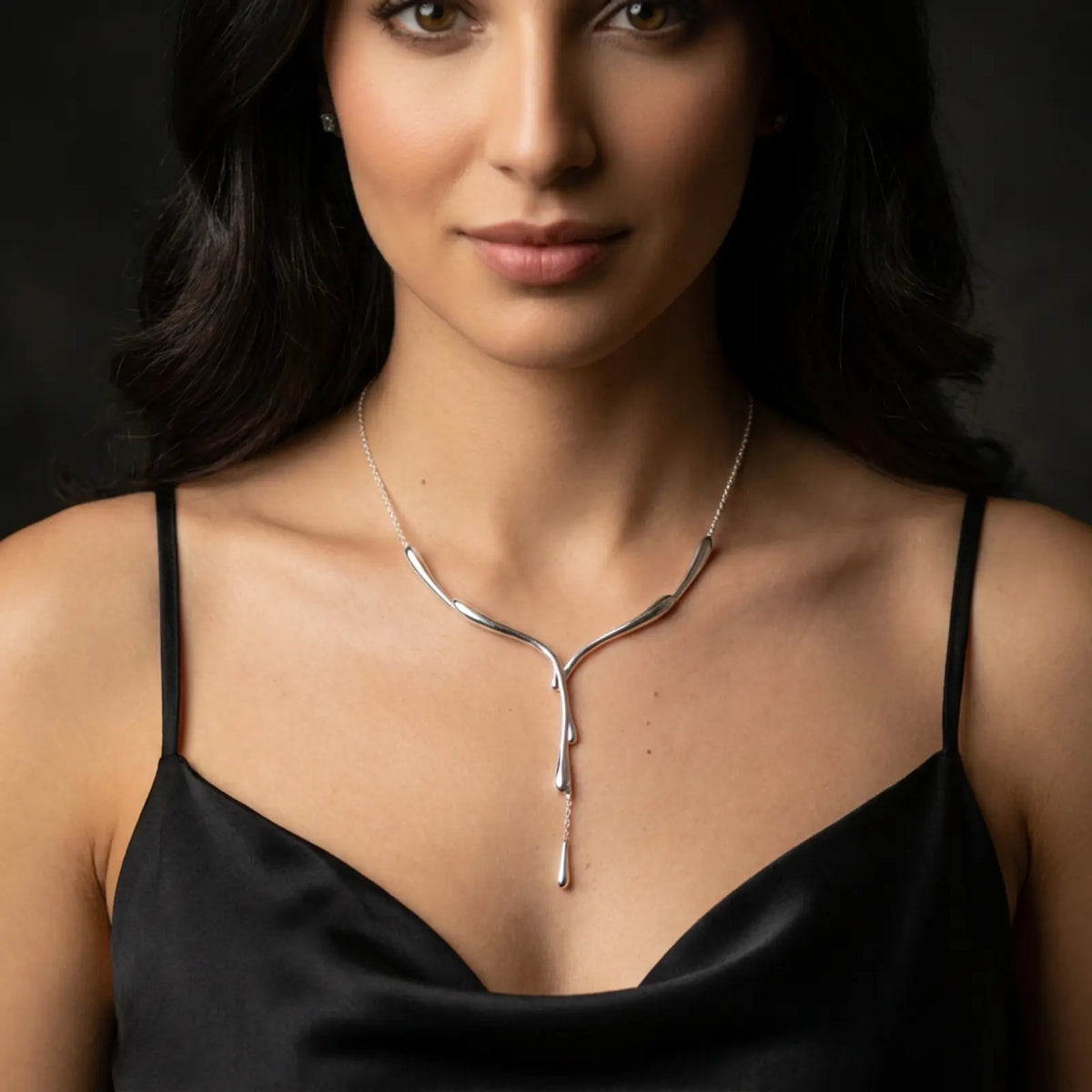 Dripping Silver Necklace worn on model in black dress with silver arm cuff — sterling silver lariat drip necklace