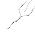 Dripping Silver Necklace on white background — sculptural sterling silver lariat with fluid drip bar and cascading droplet pendant