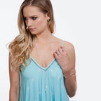 Droplet Silver Stud Earrings worn on model in turquoise dress styled with Drip Collection necklace and rings