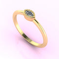 Angled view of a dainty marquise diamond ring with a horizontal East-West setting in a polished yellow gold band.