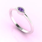 Three-quarter angled view of the dainty violet sapphire ring highlighting the modern horizontal setting and tapered marquise cut.