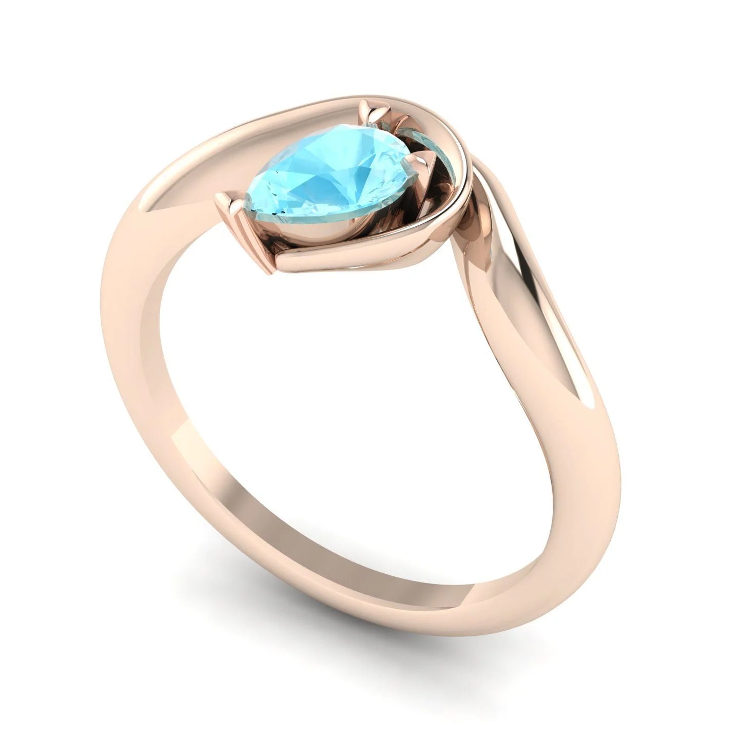 Enchanted aquamarine pear engagement ring in rose gold, three-quarter angle view showing vivid blue stone nestled in asymmetric setting