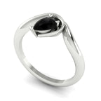 Enchanted black diamond pear engagement ring in white gold, three-quarter angle view showing ink-dark stone and asymmetric setting