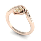 Enchanted champagne diamond pear engagement ring in rose gold, three-quarter angle view showing warm honeyed stone and asymmetric setting