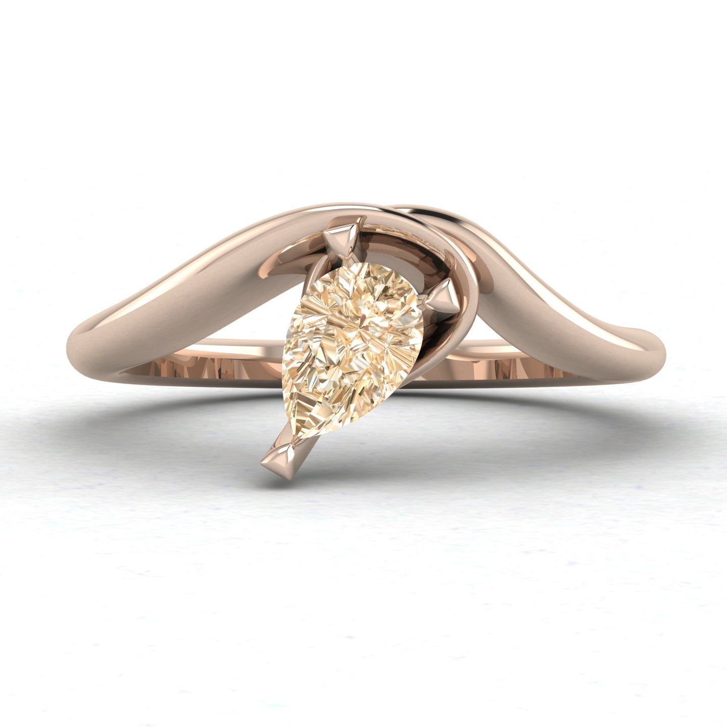 Enchanted pear shaped champagne diamond asymmetric solitaire engagement ring in rose gold, front view showing sculptural sweeping band