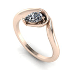 Enchanted pear diamond engagement ring in rose gold, three-quarter angle view showing brilliant stone nestled in wrapped asymmetric setting