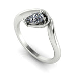 Enchanted pear diamond engagement ring in white gold, three-quarter angle view showing brilliant stone nestled in asymmetric organic setting
