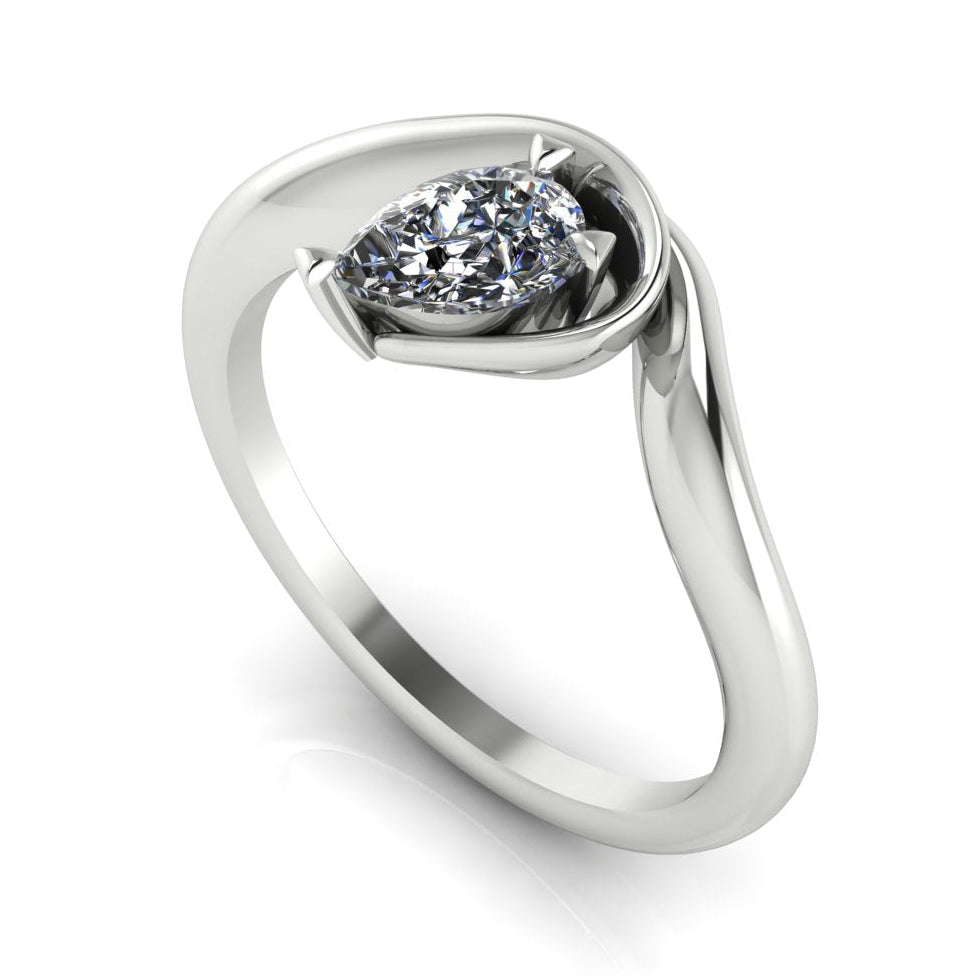 Enchanted pear diamond engagement ring in white gold, three-quarter angle view showing brilliant stone nestled in asymmetric organic setting