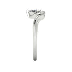 Enchanted pear diamond ring in white gold, side profile view showing dramatic sculptural asymmetric height and elegant sweeping band silhouette