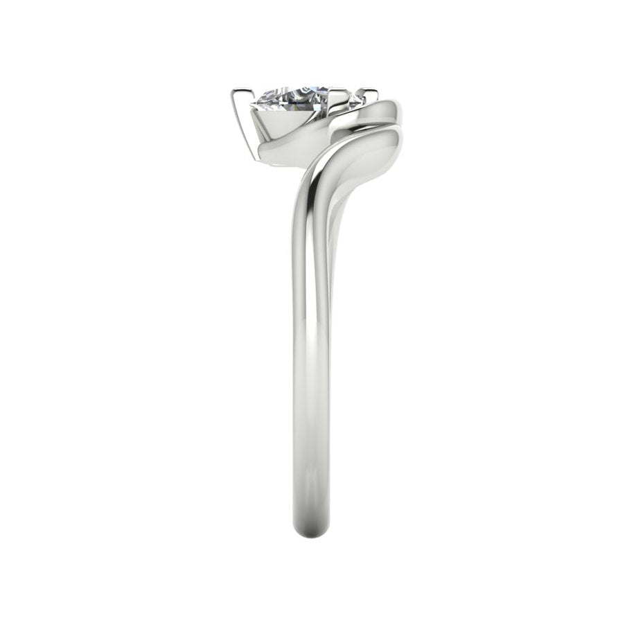 Enchanted pear diamond ring in white gold, side profile view showing dramatic sculptural asymmetric height and elegant sweeping band silhouette