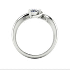 Enchanted pear diamond ring in white gold, through-finger view showing clean interior gallery and low-set asymmetric profile