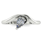 Enchanted pear shaped diamond ring in white gold, overhead top-down view showing brilliant stone and fluid sweeping band design