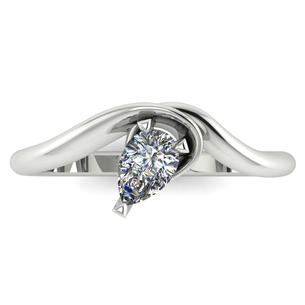 Enchanted pear shaped diamond ring in white gold, overhead top-down view showing brilliant stone and fluid sweeping band design